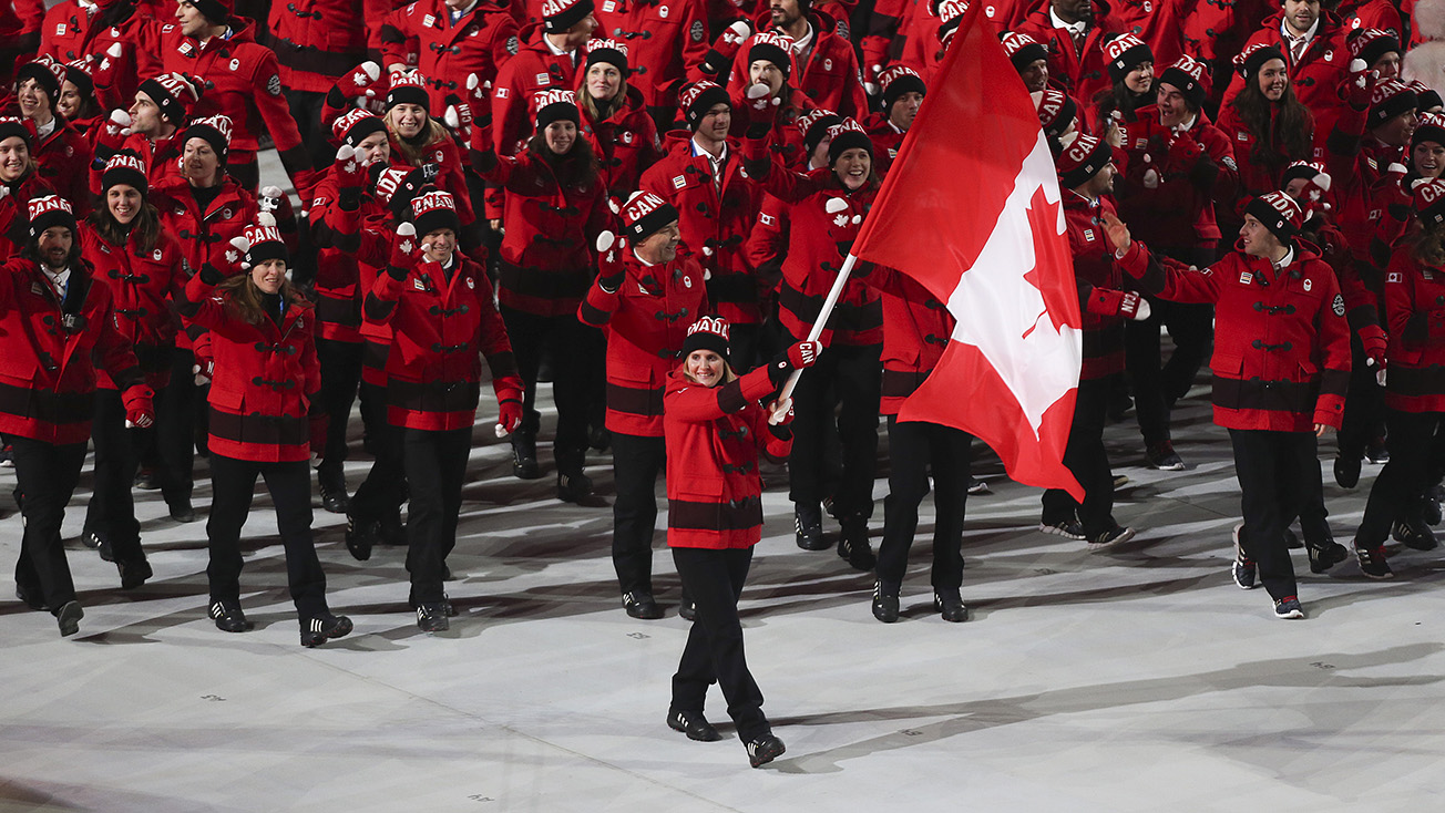 Hayley Wickenheiser leads Canada out during the Opening Ceremony at Sochi 2014. 