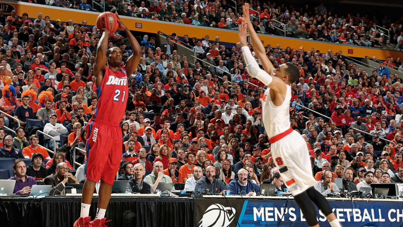 Dyshawn Pierre shoots over fellow Canadian Tyler Ennis in Dayton's upset win against Syracuse. 
