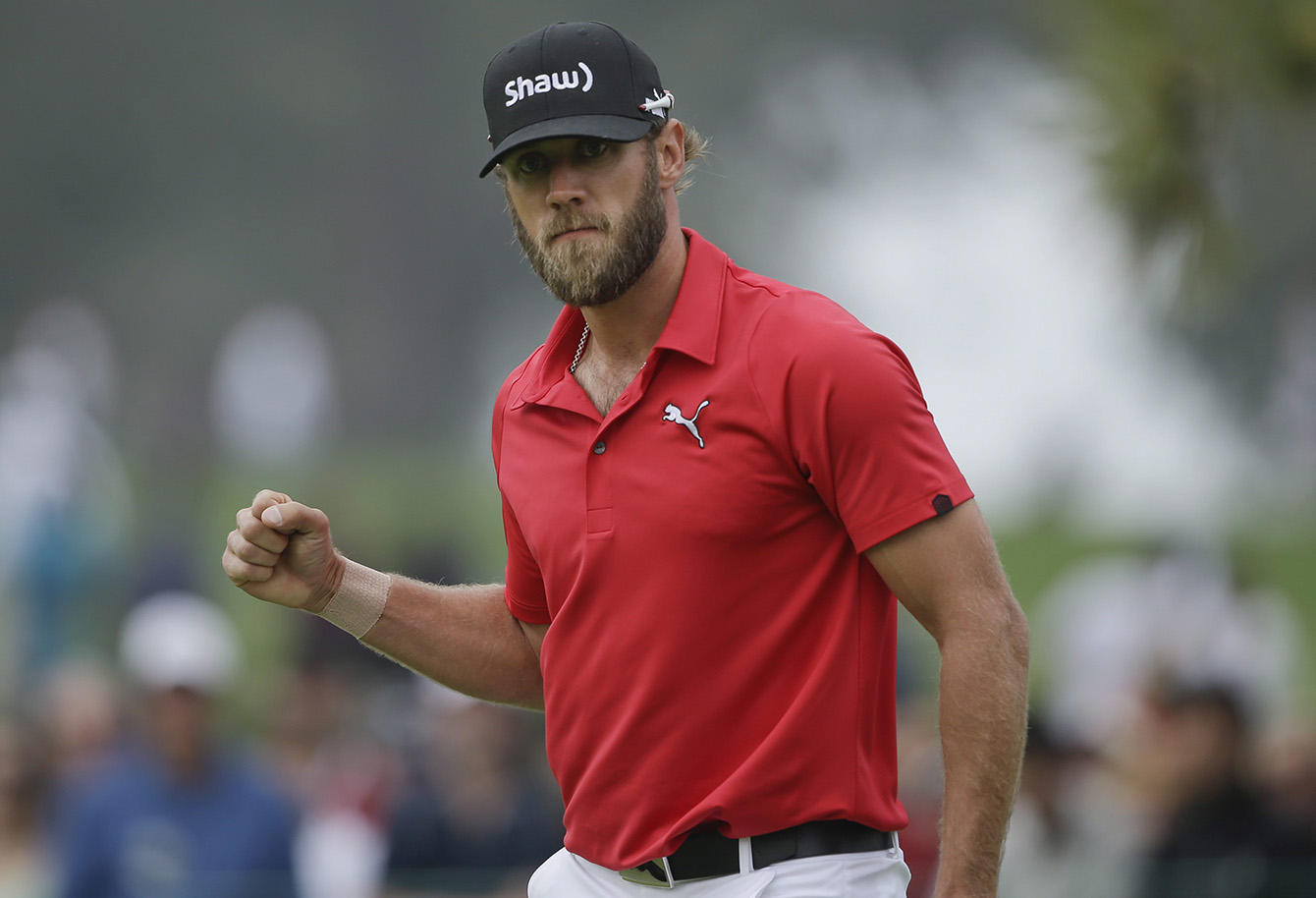 DeLaet reacts after sinking his putt for eagle on the sixth hole of the South Course at Torrey Pines during the final round of the 2014 Farmers Insurance Open.  He finished 2nd.