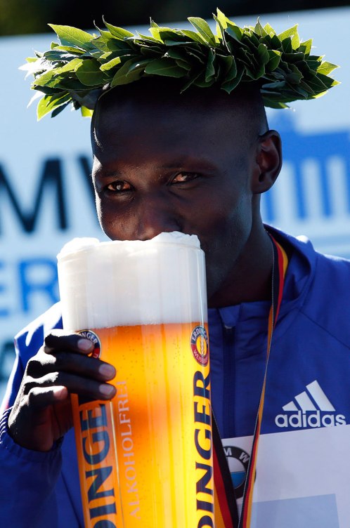 Wilson Kipsang enjoys a well-earned beverage after breaking the marathon world record in 2013. 