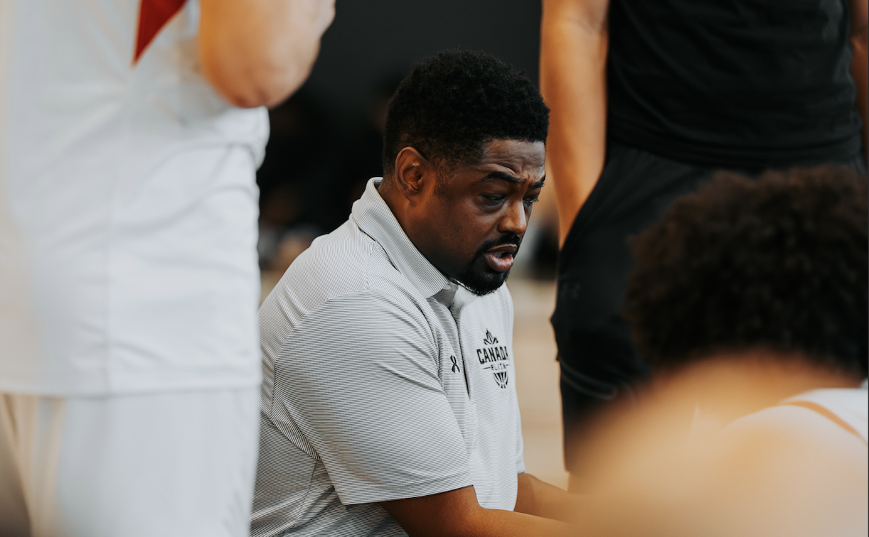 Chris Skinner talks to his team while they are gathered around him