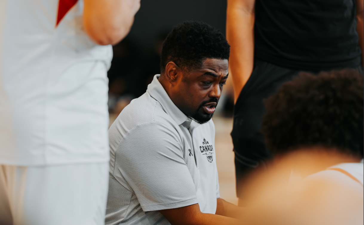 Chris Skinner talks to his team while they are gathered around him