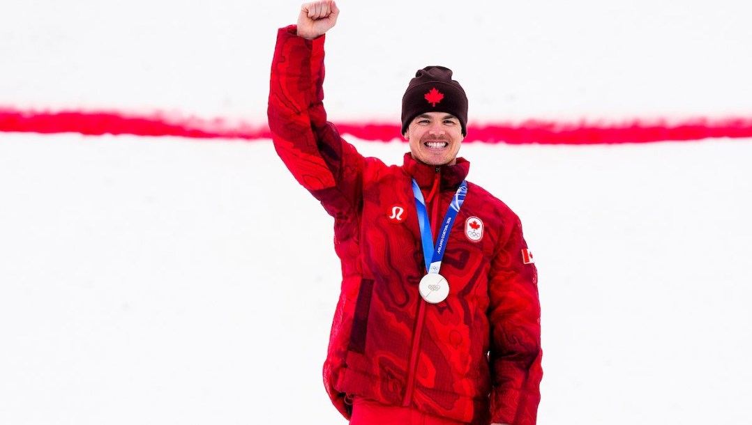 Mikaël Kingsbury on the olympic podium.