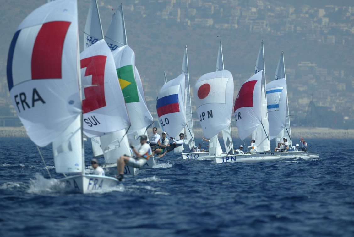 A lot of sailing boats in a line as they race on the ocean