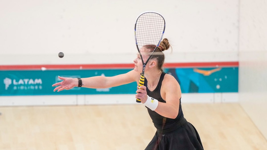 Holly Naughton prepares to hit a squash ball