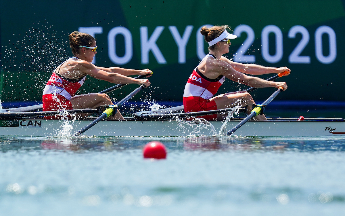 Two female rowers compete in a double sculls event