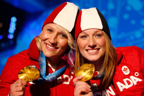 Canadian bobsleigh gold medallists Kaillie Humphries, left, and Heather Moyse pose with their medals at the awards ceremony on Thursday February, 25, 2010 at the Whistler Olympic Park during the 2010 Olympic Winter Games. THE CANADIAN PRESS/Jeff McIntosh
