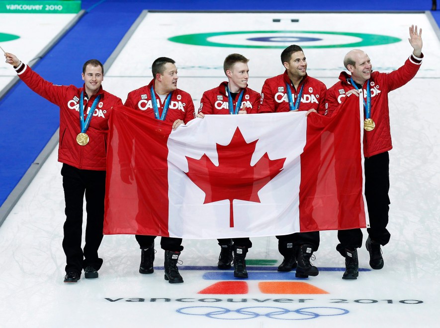 Canada alternate Adam Enright, left to right, lead Ben Hebert second Marc Kennedy, third John Morris and skip Kevin Martin show off their gold medals after defeating Norway during Olympic men's curling finals action at the Olympic Centre on Saturday, Feb. 27, 2010 during the Olympic Winter Games in Vancouver. THE CANADIAN PRESS/Nathan Denette