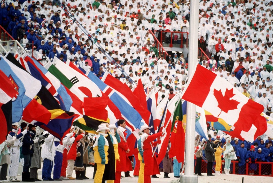 Brian Orser carrying the Canadian flag