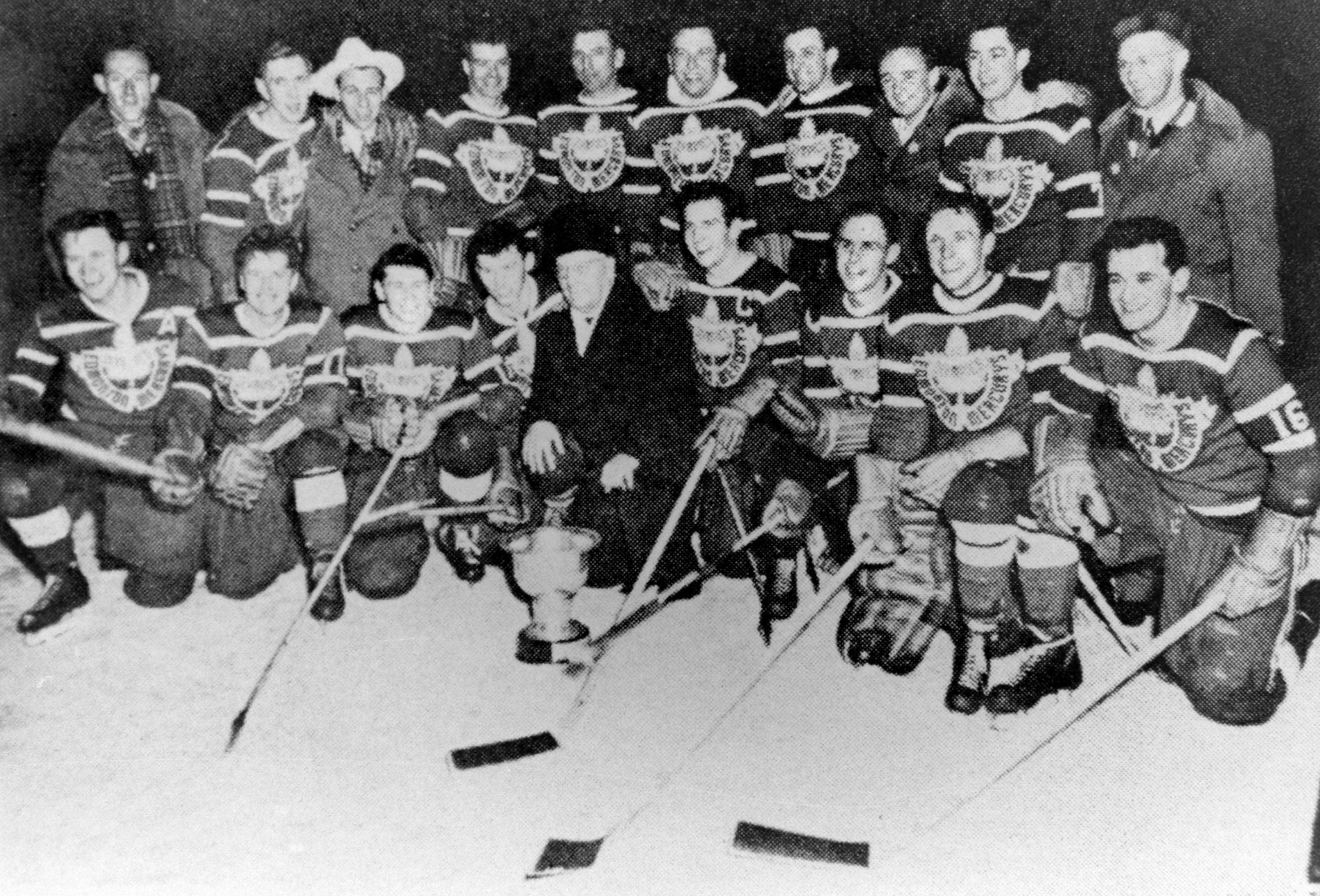 Canada's hockey team, represented by the Edmonton Mercurys, celebrates its gold medal win at the Oslo 1952 Olympic Winter Games. (CP Photo/COC)