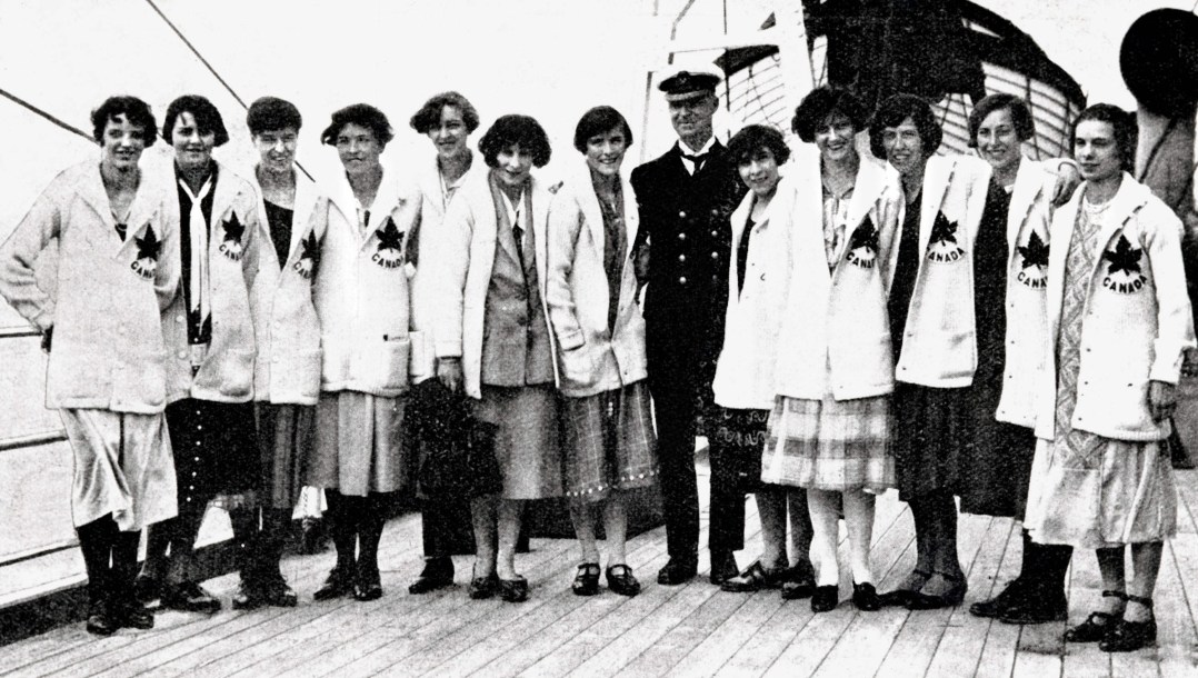 Canadian women stand in uniform on a boat