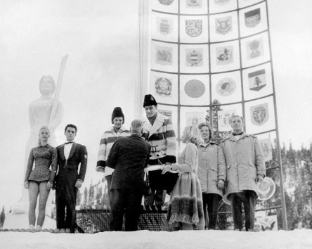Canada's Barbara Wagner and Robert Paul (centre) celebrate their gold medal in the pairs figure skating event at the Squaw Valley 1960 Olympic Winter Games. (CP Photo/COC)