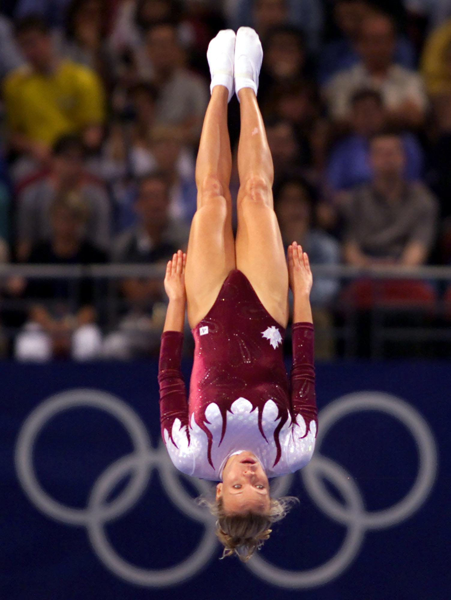 Canadian trampolinist Karen Cockburn, of Toronto, performs on the trampoline during the final compulsory portion of her routine at the Olympic Games in Sydney Australia Friday Sept 22, 2000. Cockburn won the bronze medal.(CP PHOTO/Tom Hanson)