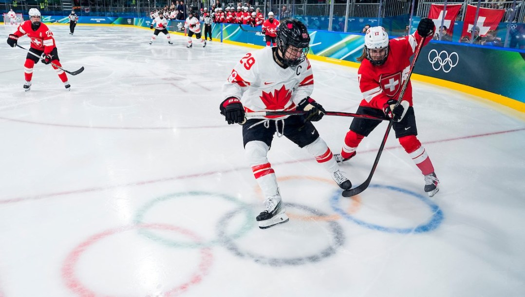 Marie-Philip Poulin competes in ice hockey.