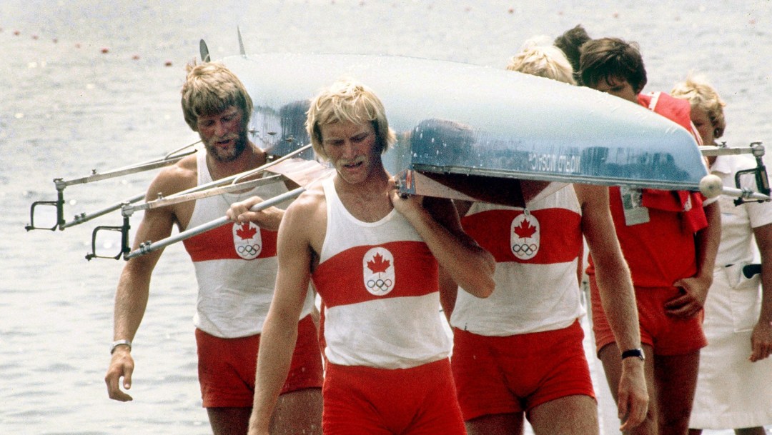 A group of Canadian rowers carry their boat at the 1976 Montreal Olympic Games
