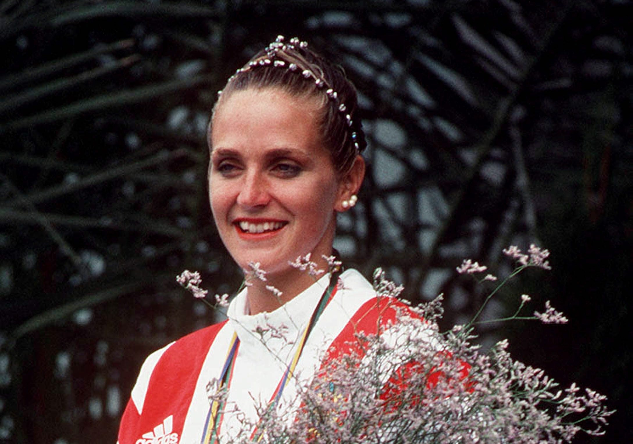 Canada's Sylvie Fréchette celebrates the silver medal she won in the synchronized swimming event at the 1992 Olympic Games in Barcelona. Due to a judging error at the games, Sylvie was later awarded the gold medal (CP PHOTO/ COC/ Ted Grant)