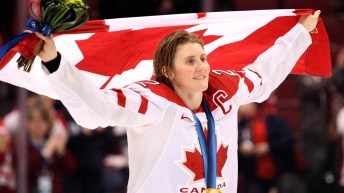 Wickenheiser celebrating with Canadian flag