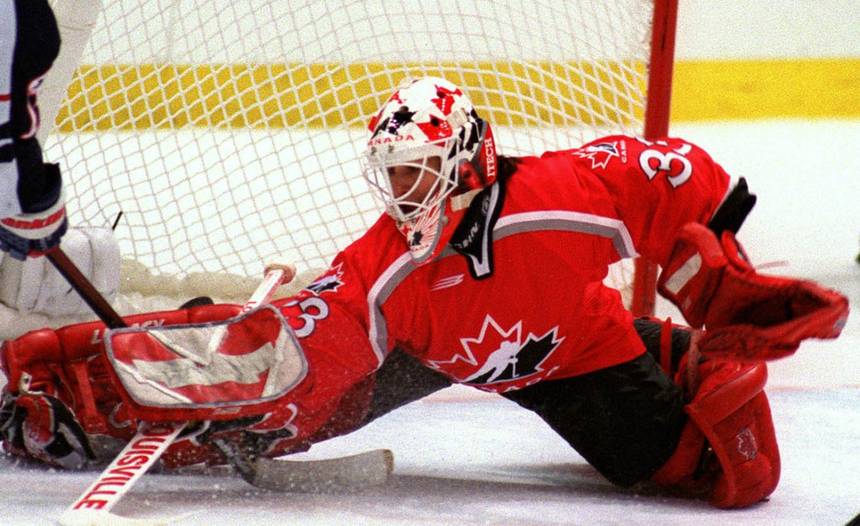 Manon Rheaume saving a shot