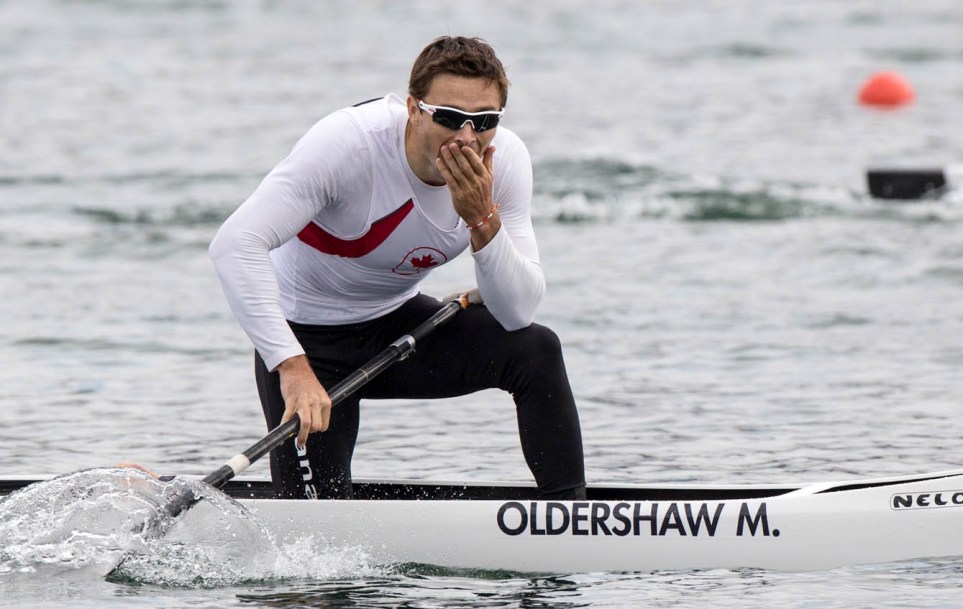 Mark Oldershaw reacts to his bronze medal win on a canoe