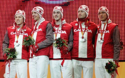 Canada's men's long track pursuit team from, left, Jason Parker of Winnipeg, Justin Warsyleweicz of Regina, Denny Morrison of Fort St. John, B.C., Steven Elm of Red Deer, Alta. and Arne Dankers of Calgary pose with their silver medals at the Olympic Winter Games in Turin, Italy, Friday, Feb. 17, 2006. (CP PHOTO/COC/Mike Ridewood)