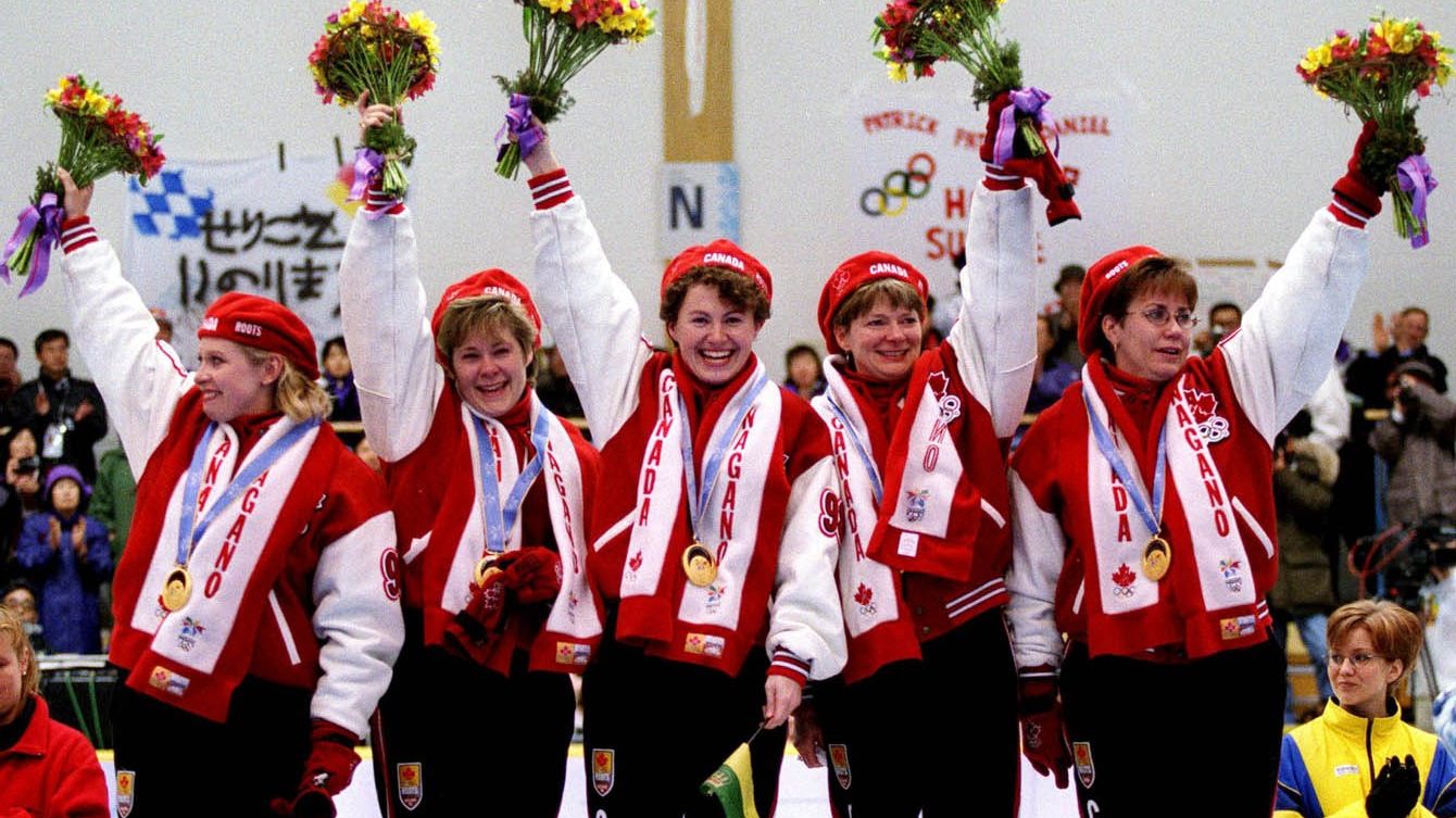 Canada's Women's curling team Atina Ford, Marcia Gudereit, Joan McCusker, Jan Betker and Sandra Schmirler after winning a gold medal at the Nagano 1998 Olympic Winter Games. (CP PHOTO/COC)
