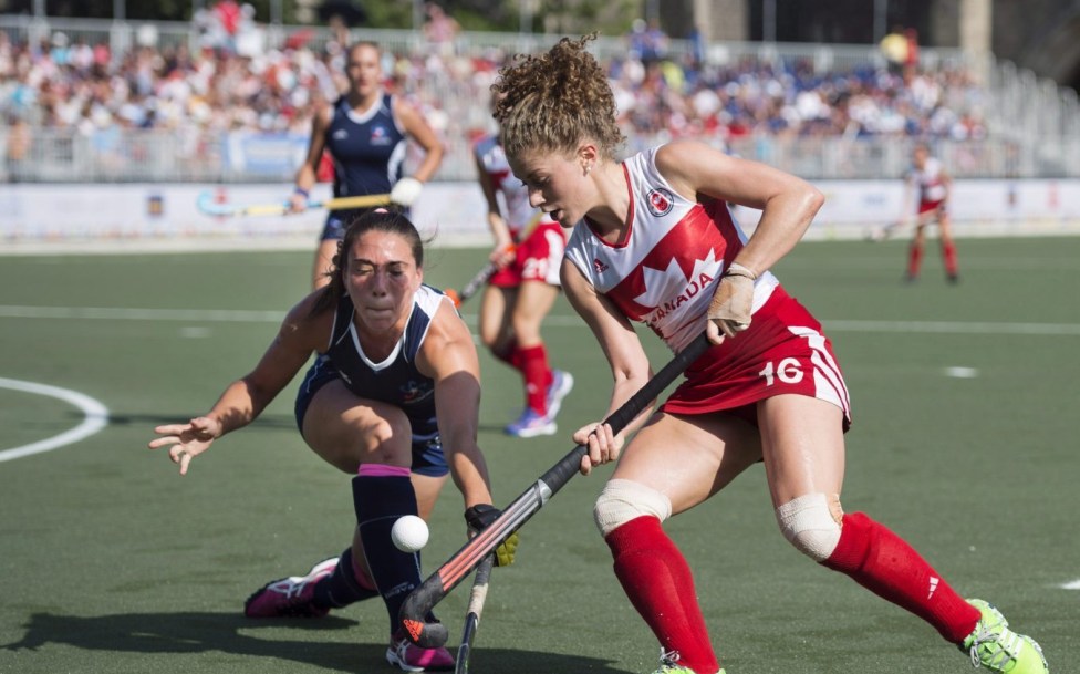 Natalie Sourisseau, right, of Canada, battles for the ball