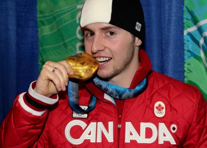 Alex Bilodeau of Rosemere, Que. with his gold medal for men's moguls at the Olympic Winter Games in Vancouver, B.C, Monday, Feb. 15, 2010. (CP PHOTO)(HO-COC-Mike Ridewood)