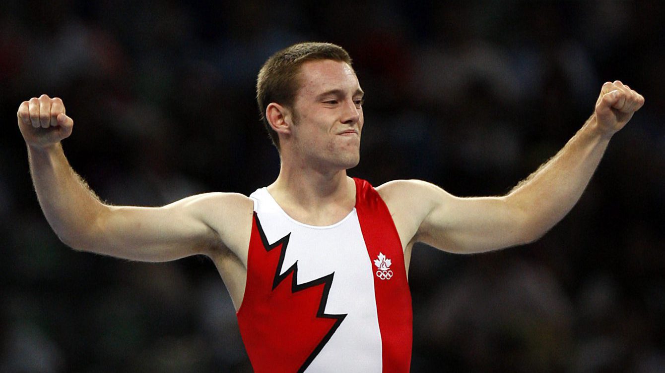 Canadian Jason Burnett pumps his arms after his routine in the Men's Trampoline Final at the National Indoor Stadium during the 2008 Beijing Olympic Games in Beijing Aug 19, 2008. Burnett went on to win the silver medal while China won gold and bronze. THE CANADIAN PRESS / COC ANDRE FORGET