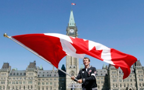 Simon Whitfield Simon Whitfield waves the Canadian flag on Parliament Hill