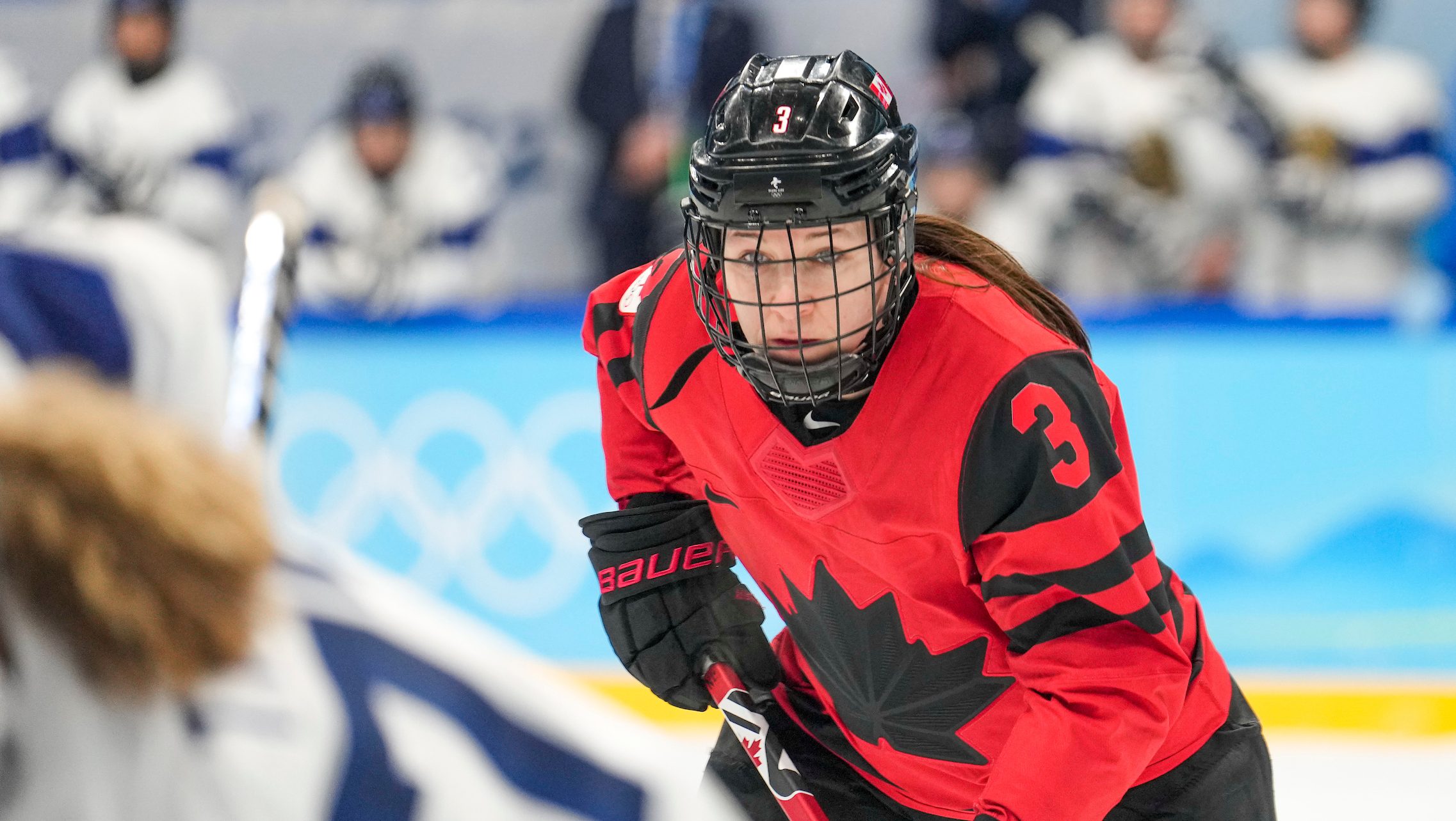 Jocelyne Larocque looks intensely at an opponent on the ice