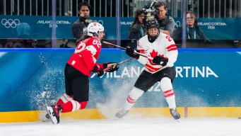 Natalie Spooner competes in ice hockey.