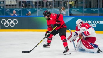 Brianne Jenner competes in ice hockey.