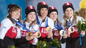 Canada's women's curling team at Sochi 2014 poses with their gold medals