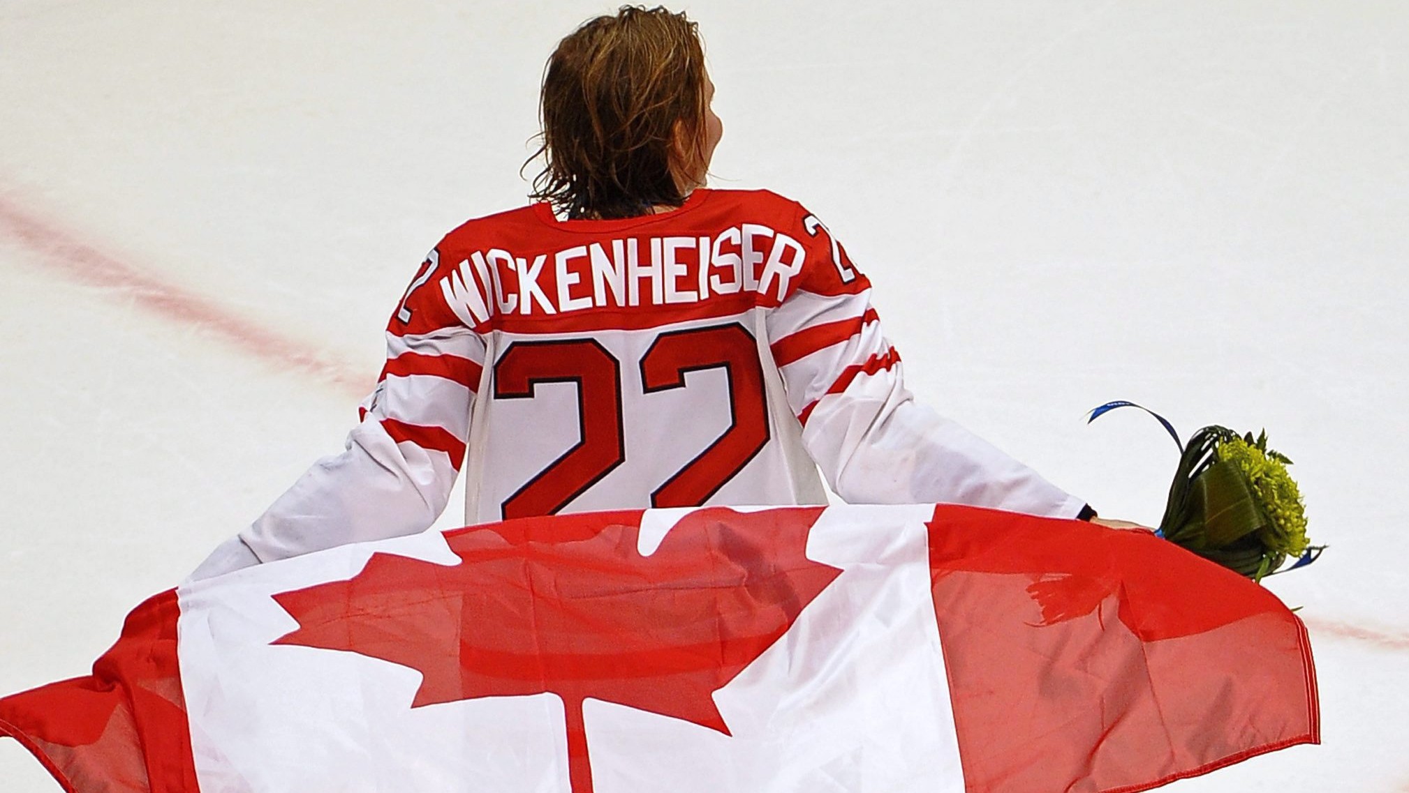 Team Canada captain Hayley Wickenheiser skates with the flag after winning the gold medal in women's Olympic hockey at Canada Hockey Place Thursday Feb. 25, 2010 at the 2010 Vancouver Olympic Winter Games in. THE CANADIAN PRESS/Scott Gardner