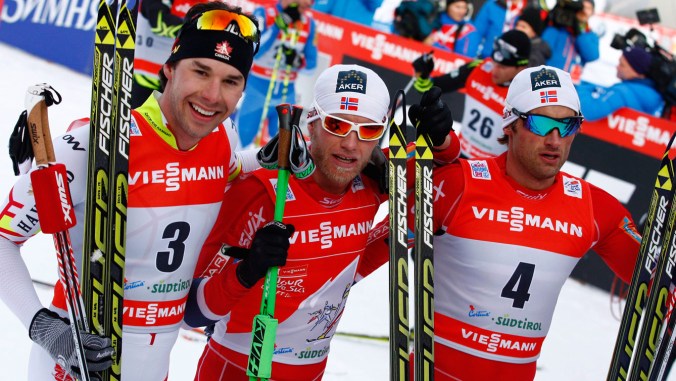Harvey (left) with the other two medallists after finishing third in the fifth stage.