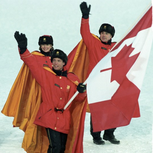 Canadian figure skater Kurt Browning carries the flag as he leads Olympic teammates onto the field during opening ceremony for the XVII Olympic Winter Games in Lillehammer Feb. 12, 1994. THE CANADIAN PRESS/Ron Poling