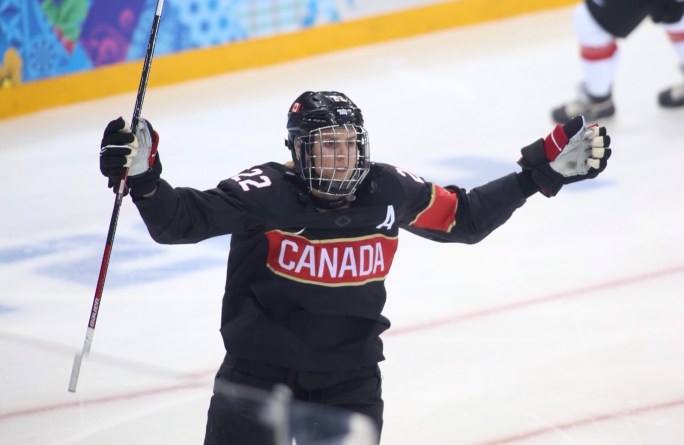 The Canadian women's hockey team celebrates after having defeated Switzerland 5 - 0