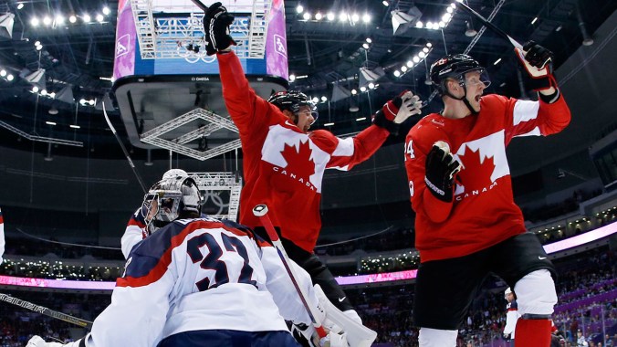 Jamie Benn and Corey Perry at Sochi 2014 Canada forward Benn Jamie, left, reacts after scoring a goal in front of USA goaltender Jonathan Quick of a men's semifinal ice hockey game at the 2014 Winter Olympics, Friday, Feb. 21, 2014, in Sochi, Russia. (AP Photo/Julio Cortez, Pool)