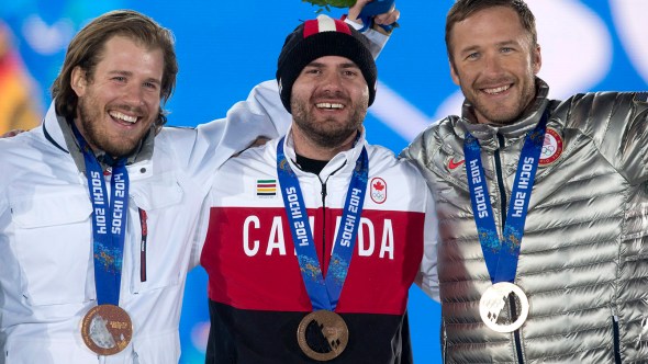 Huden stands on the podium after receiving his bronze medal (Photo: CP)