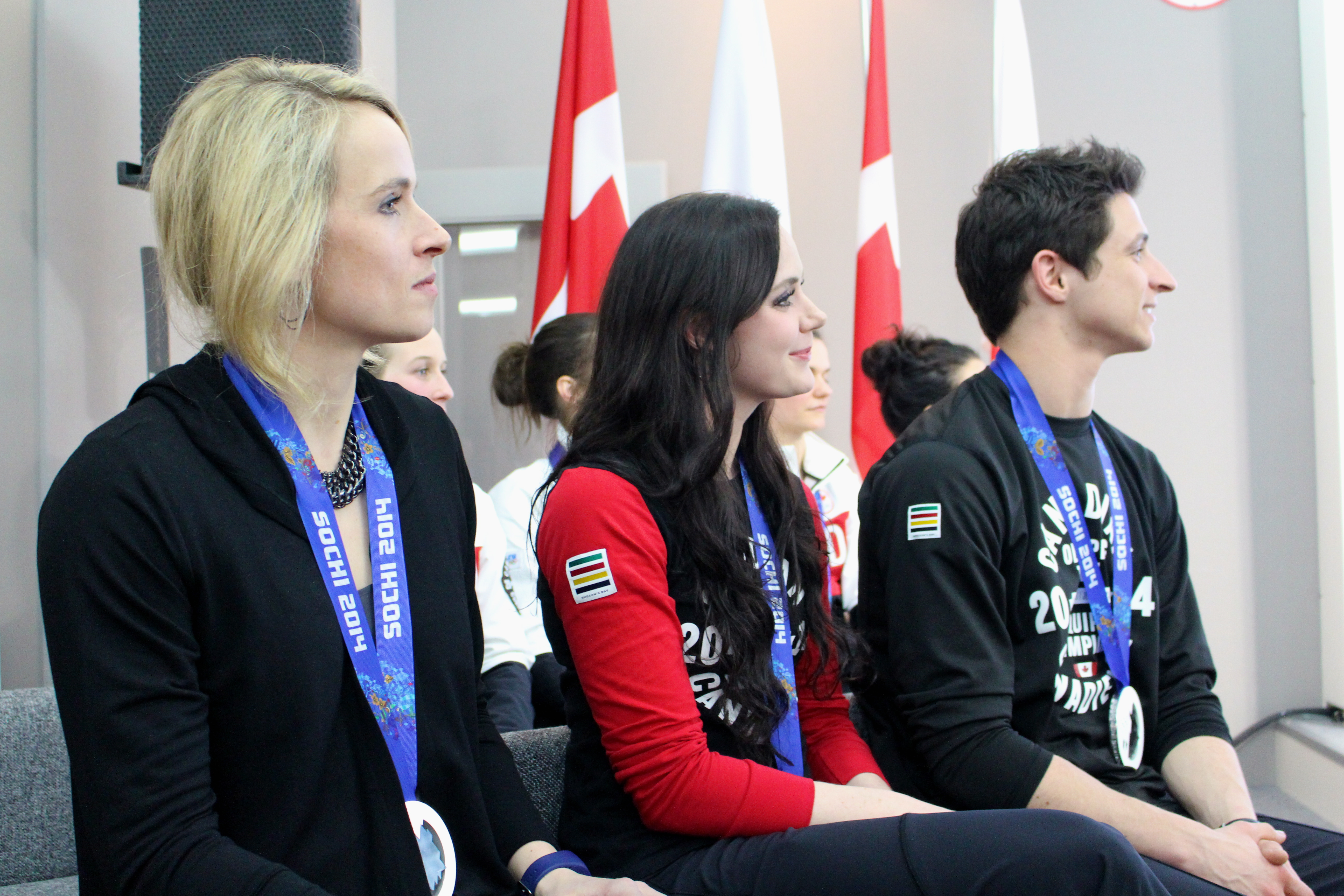 Dominique Maltais, Tessa Virtue and Scott Moir during the medal celebration