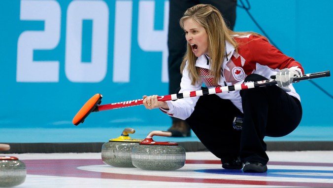 Jennifer Jones calls a shot while crouched in the rings