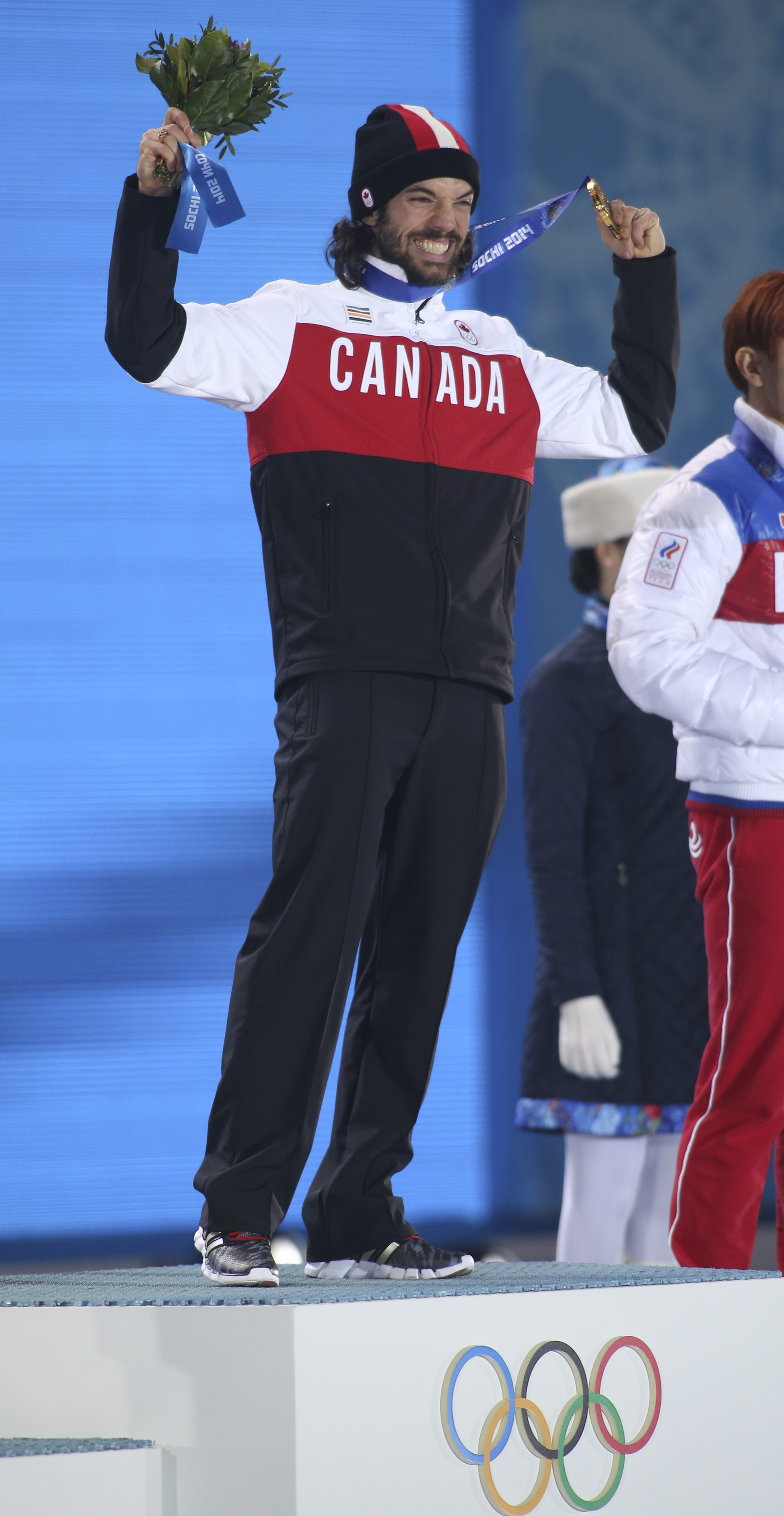 Charles Hamelin receives his gold medal in men's 1500 metre short track