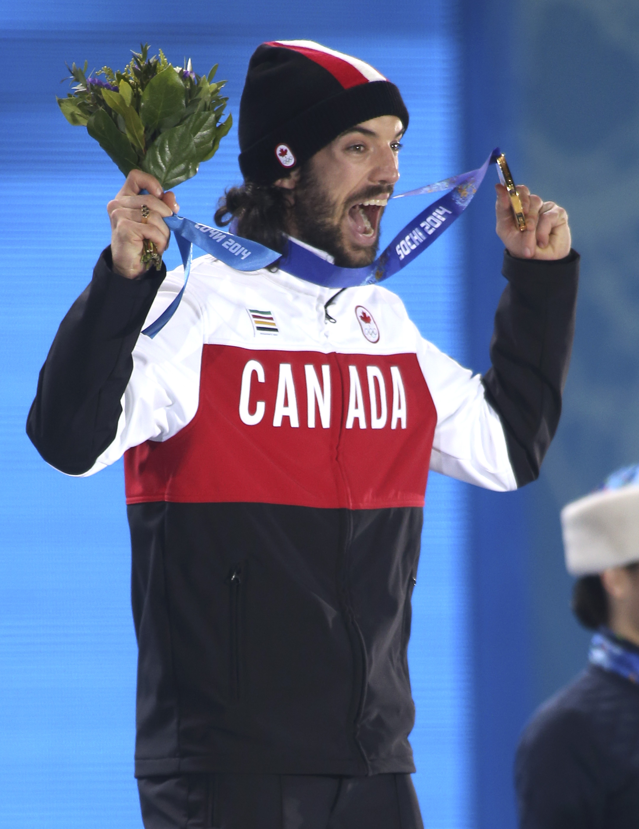 Charles Hamelin receives his gold medal in men's 1500 metre short track