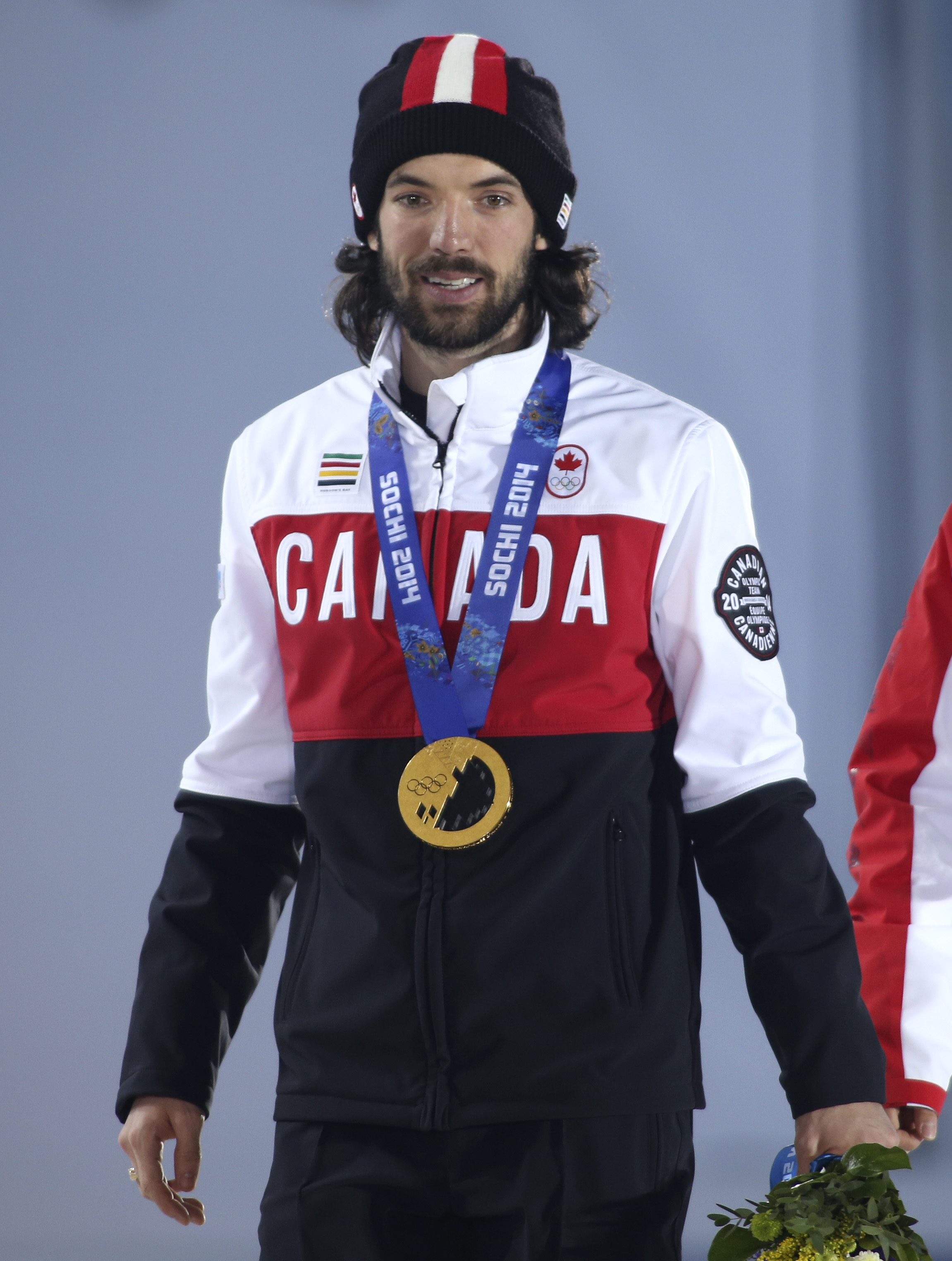 Charles Hamelin receives his gold medal in men's 1500 metre short track