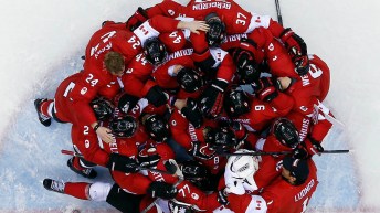 overhead view of hockey players huddled together