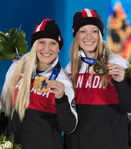 Kaillie Humphries and Heather Moyse posing with their medals
