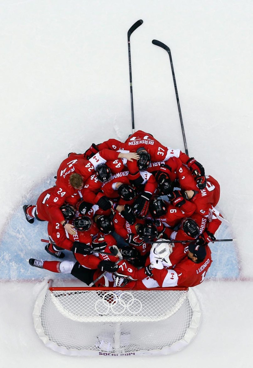 Team Canada's men's hockey team celebrating