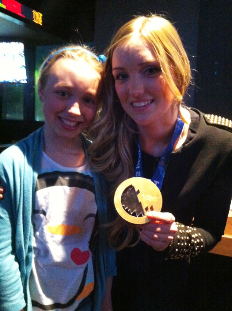 Justine with a future Olympic hopeful at the dinner with young Ontario skiers.