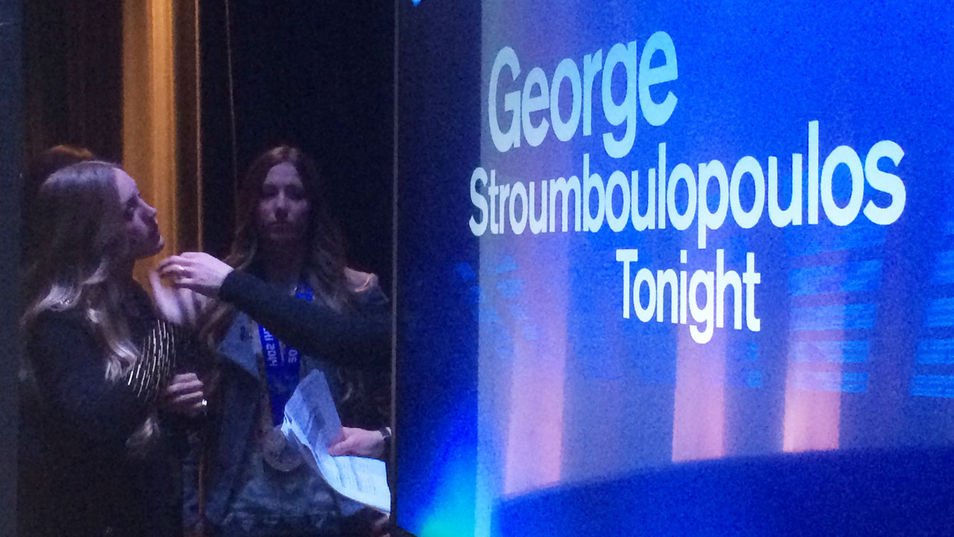 Getting ready for their intro, the Olympians wait behind the curtain on set.