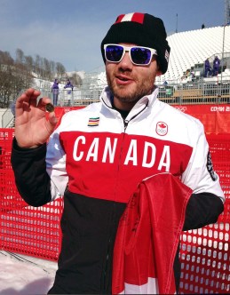 Jan Hudec holds up the Lucky Loonie that he buried at the finish line (Photo: CP)